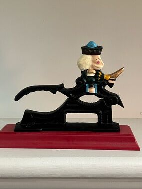 Black Cast Iron Nutcracker Figurine with Blue and Gold Accents